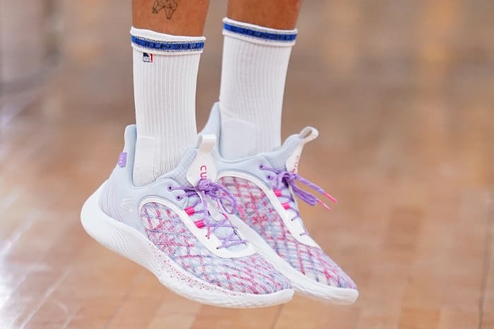 Golden State Warriors point guard Stephen Curry wearing the Curry Flow 9 'For the W'.